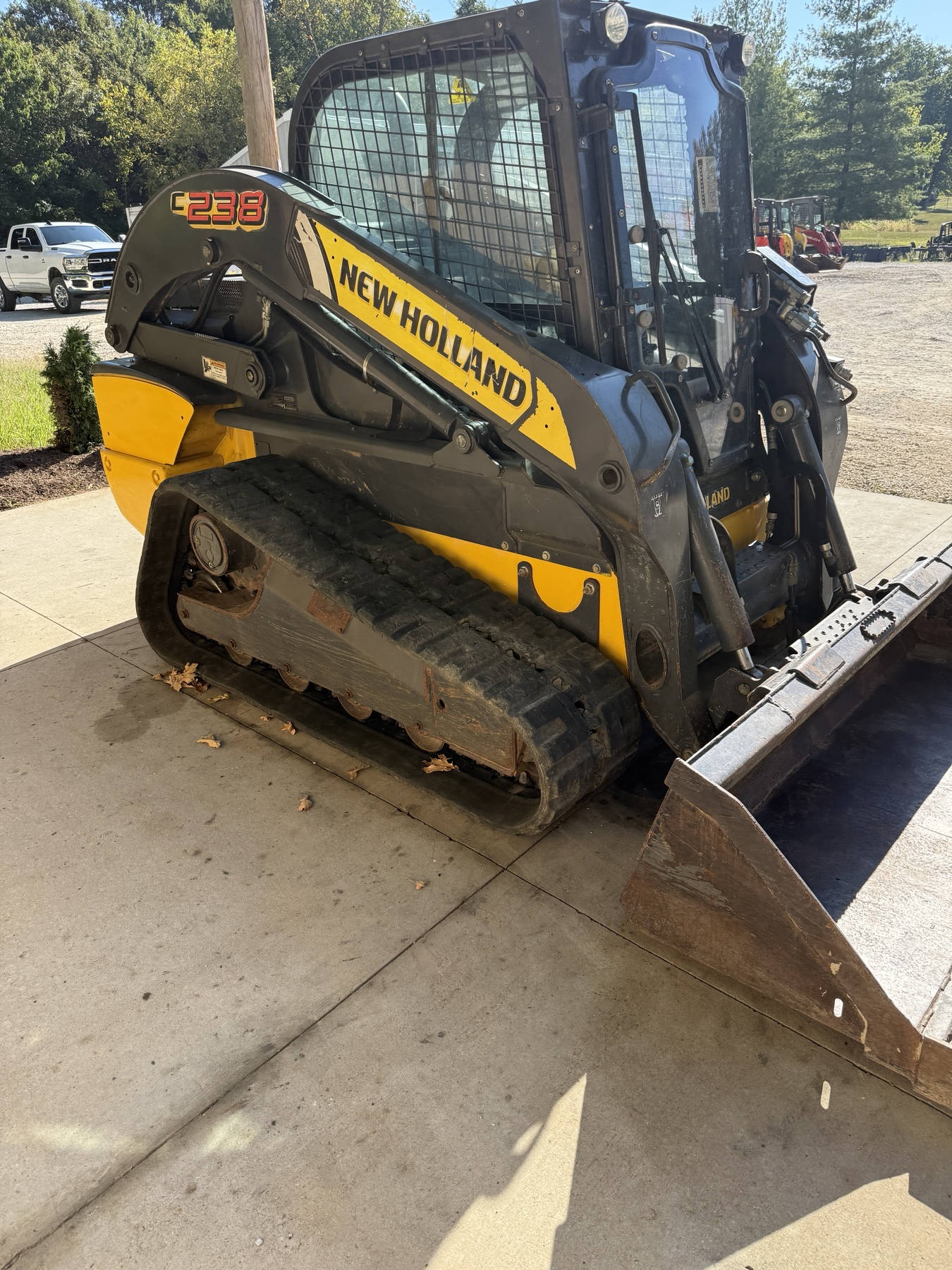 New Holland C238 left front view showing track and undercarriage