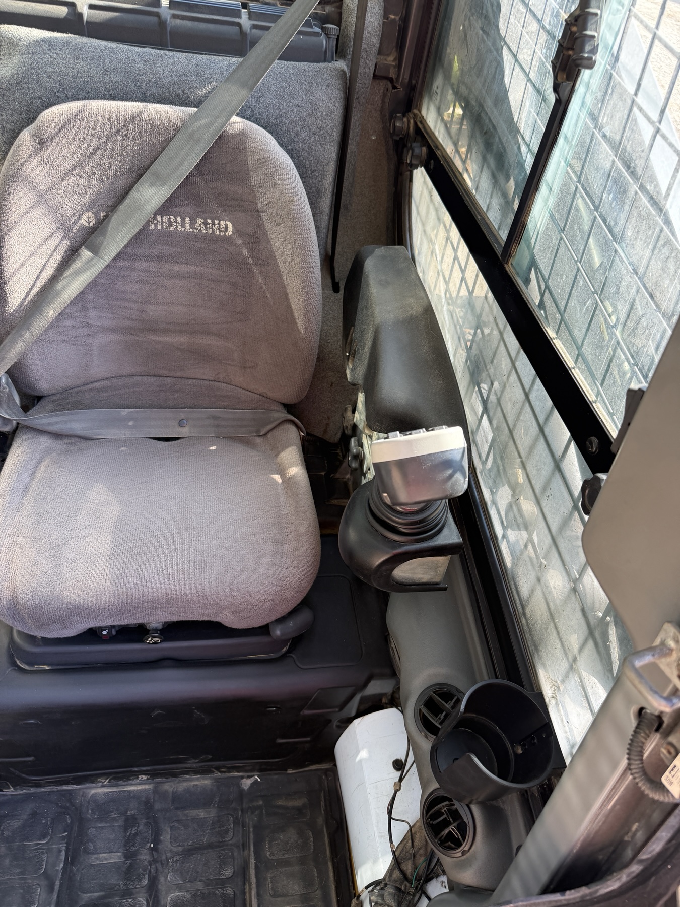 New Holland C238 operator seat and right-hand joystick