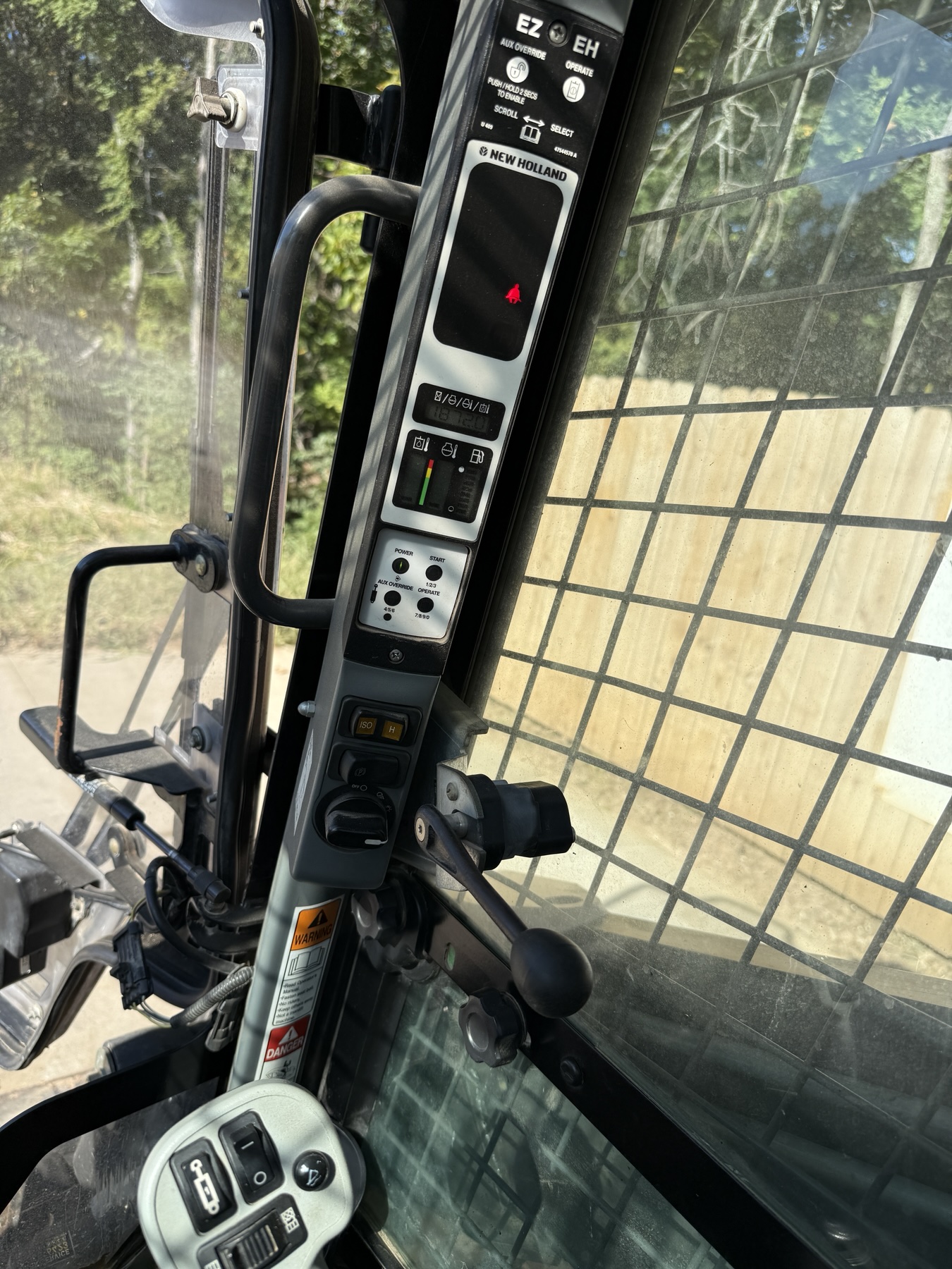 New Holland C238 hour meter showing 1,872 hours