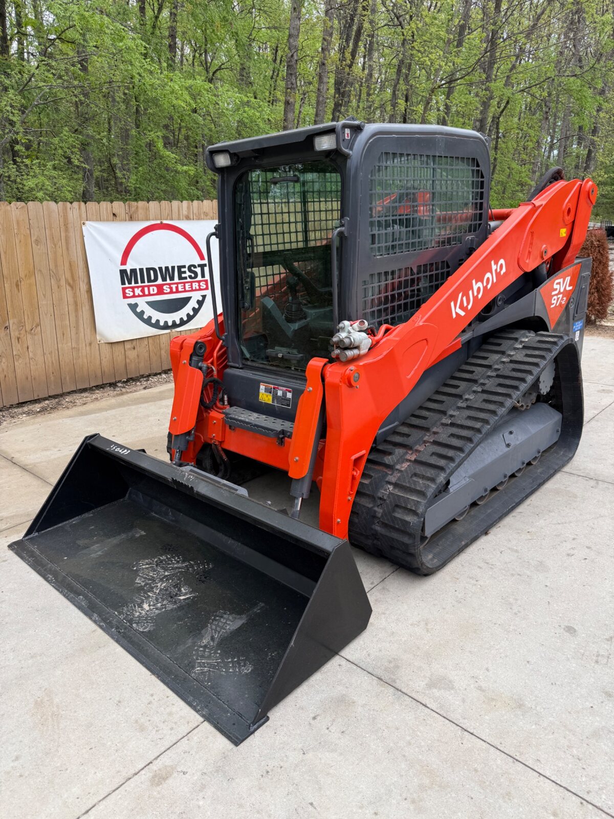 2023 Kubota SVL97-2 front three-quarter view with 80-inch smooth bucket