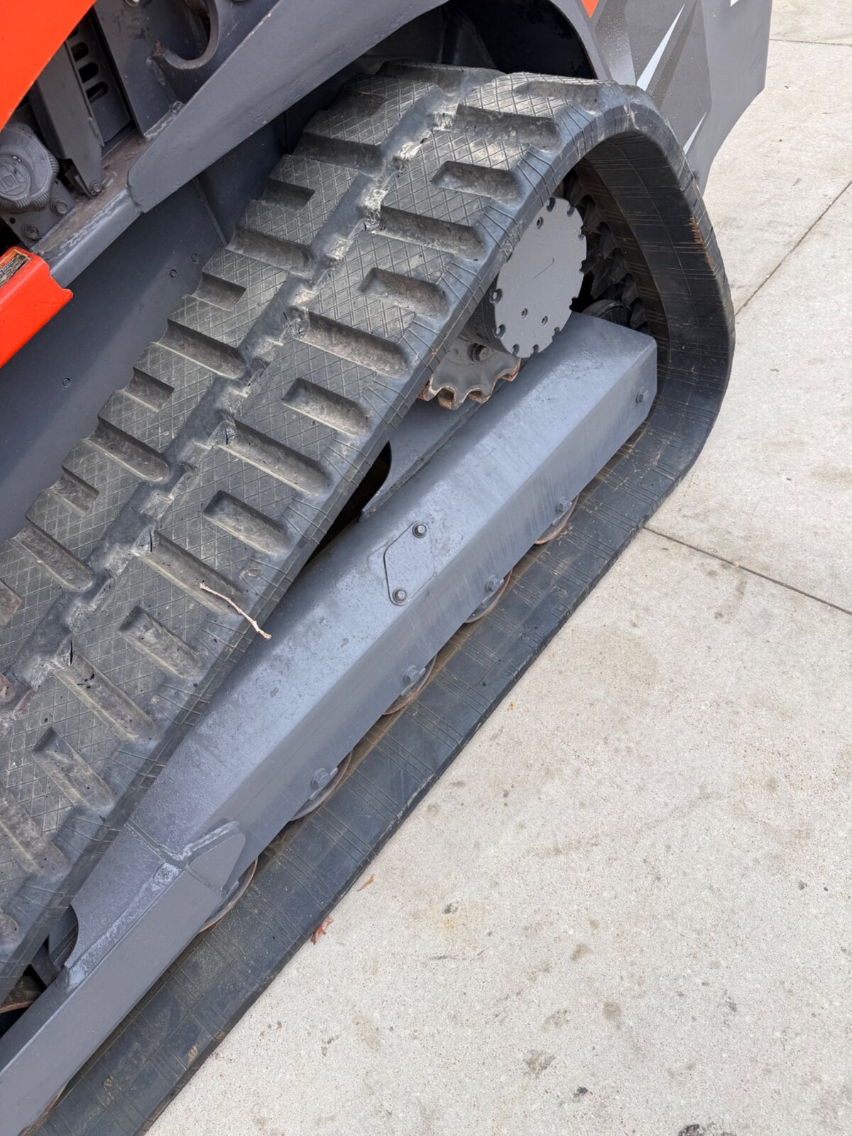 Close-up of the Kubota SVL97-2 right track and undercarriage