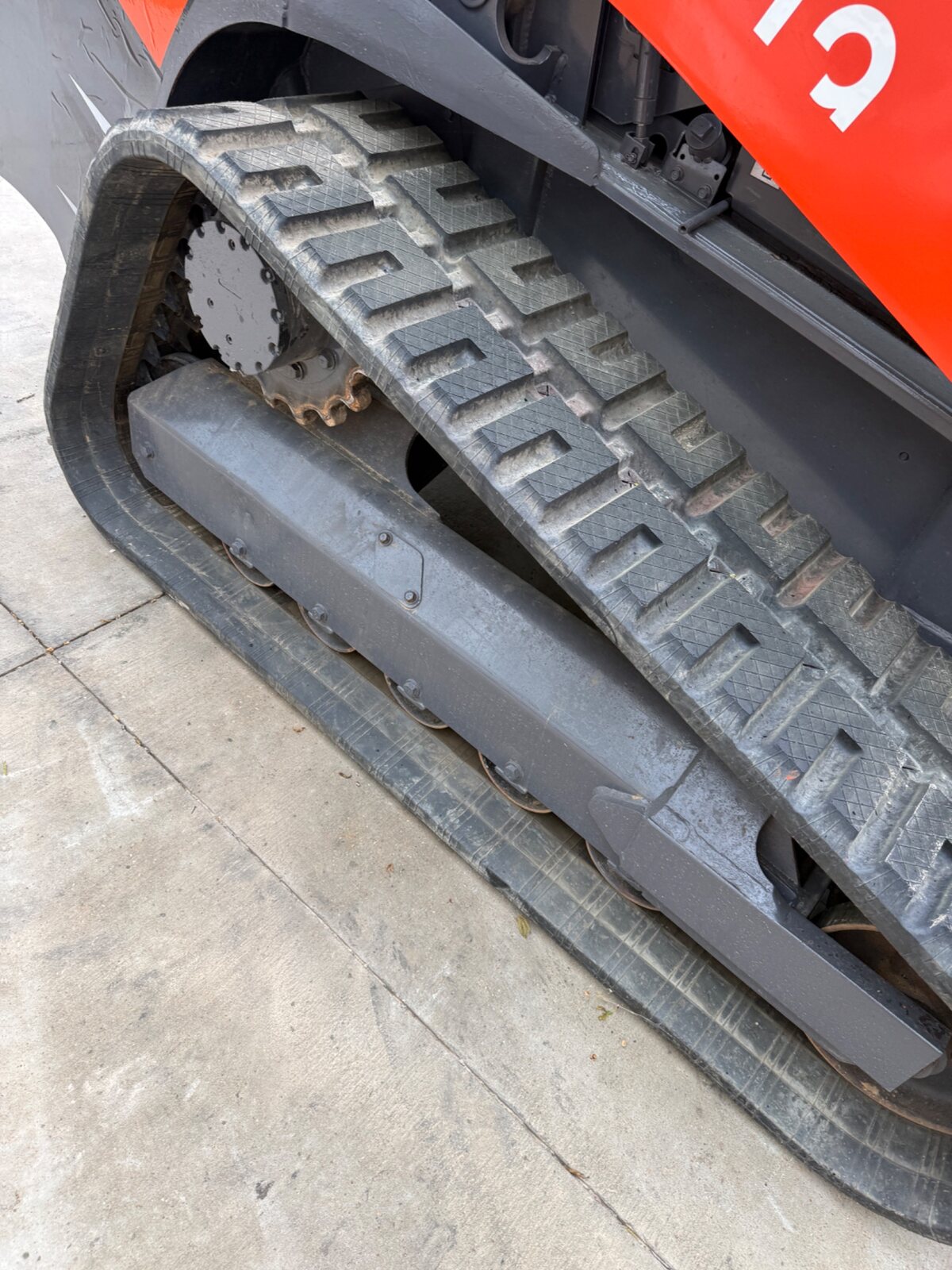 Close-up of the Kubota SVL97-2 left track and undercarriage