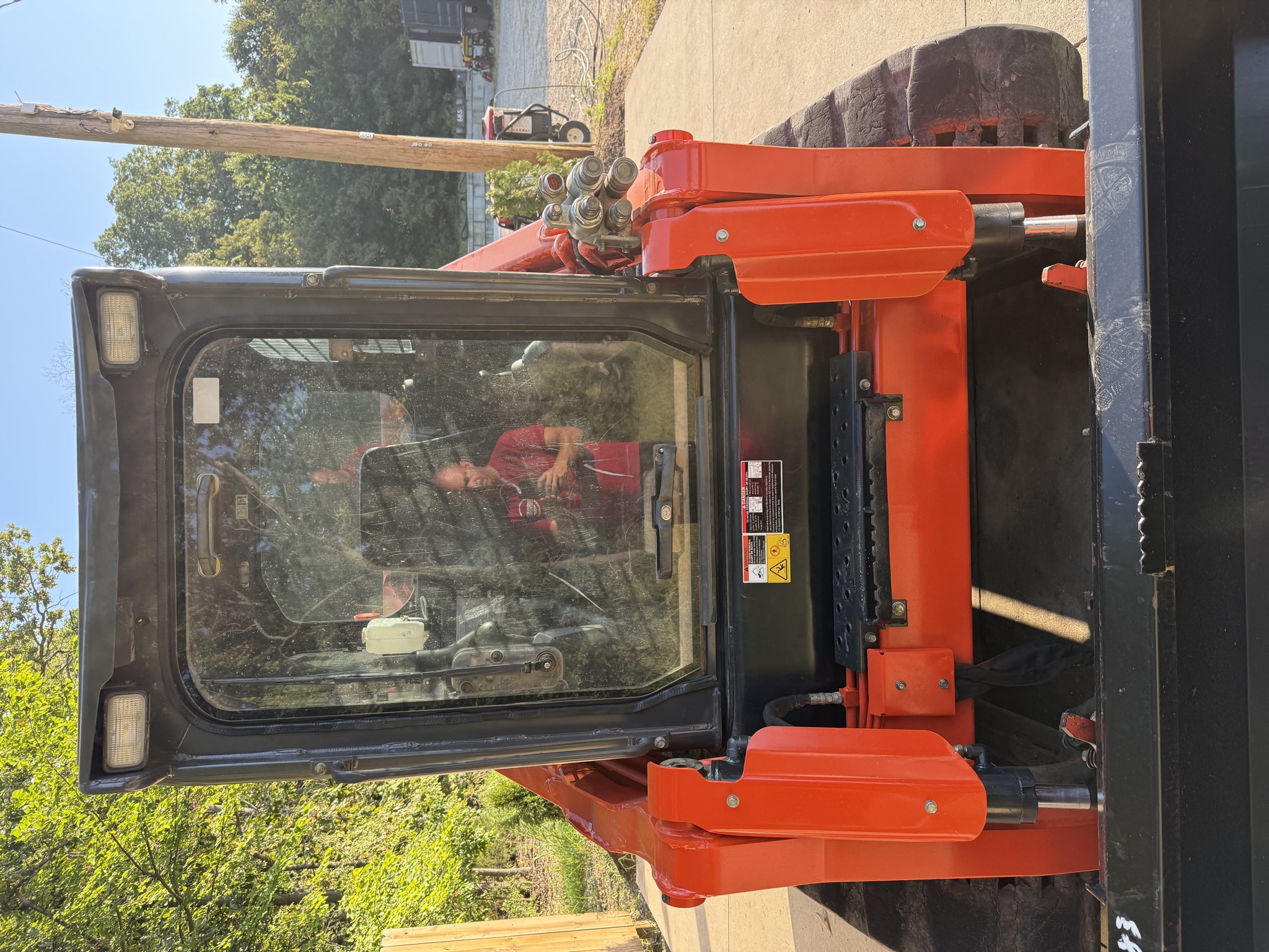 Kubota SVL97-2 enclosed cab door, entry and auxiliary couplers
