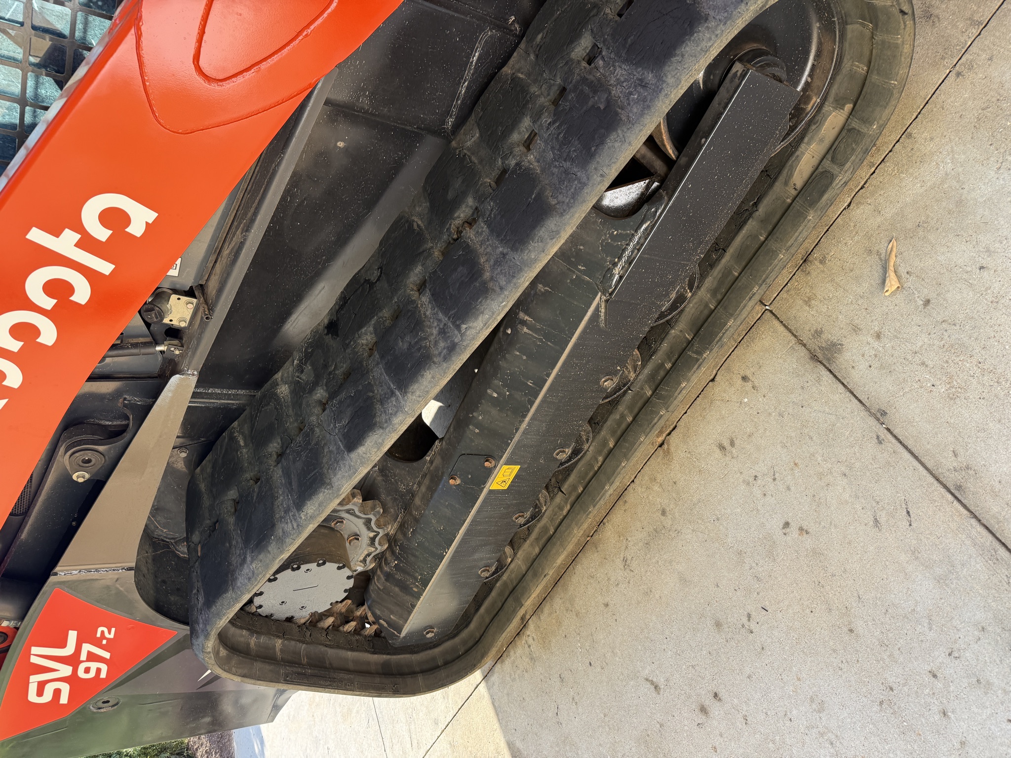 Close-up of the Kubota SVL97-2 rubber track and undercarriage