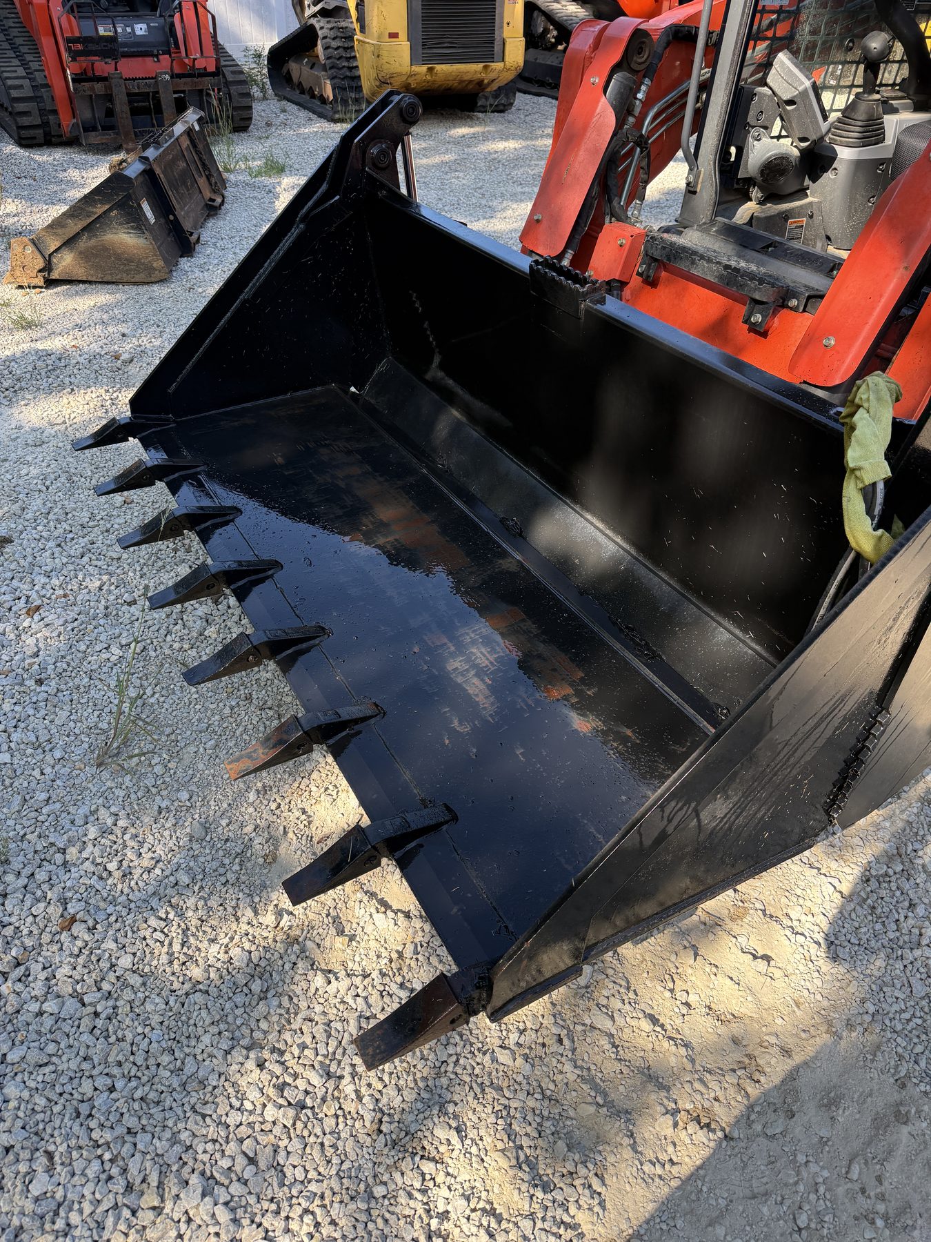 American-made 4-in-1 skid steer bucket with teeth